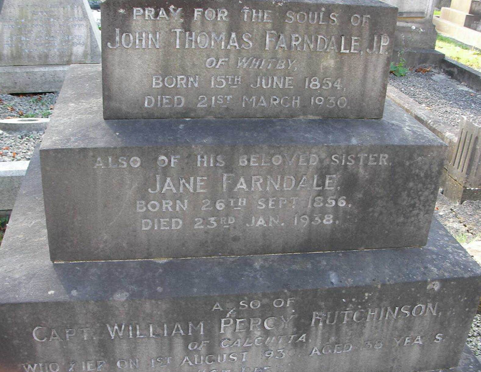 A close-up of a grave stone
Description automatically generated